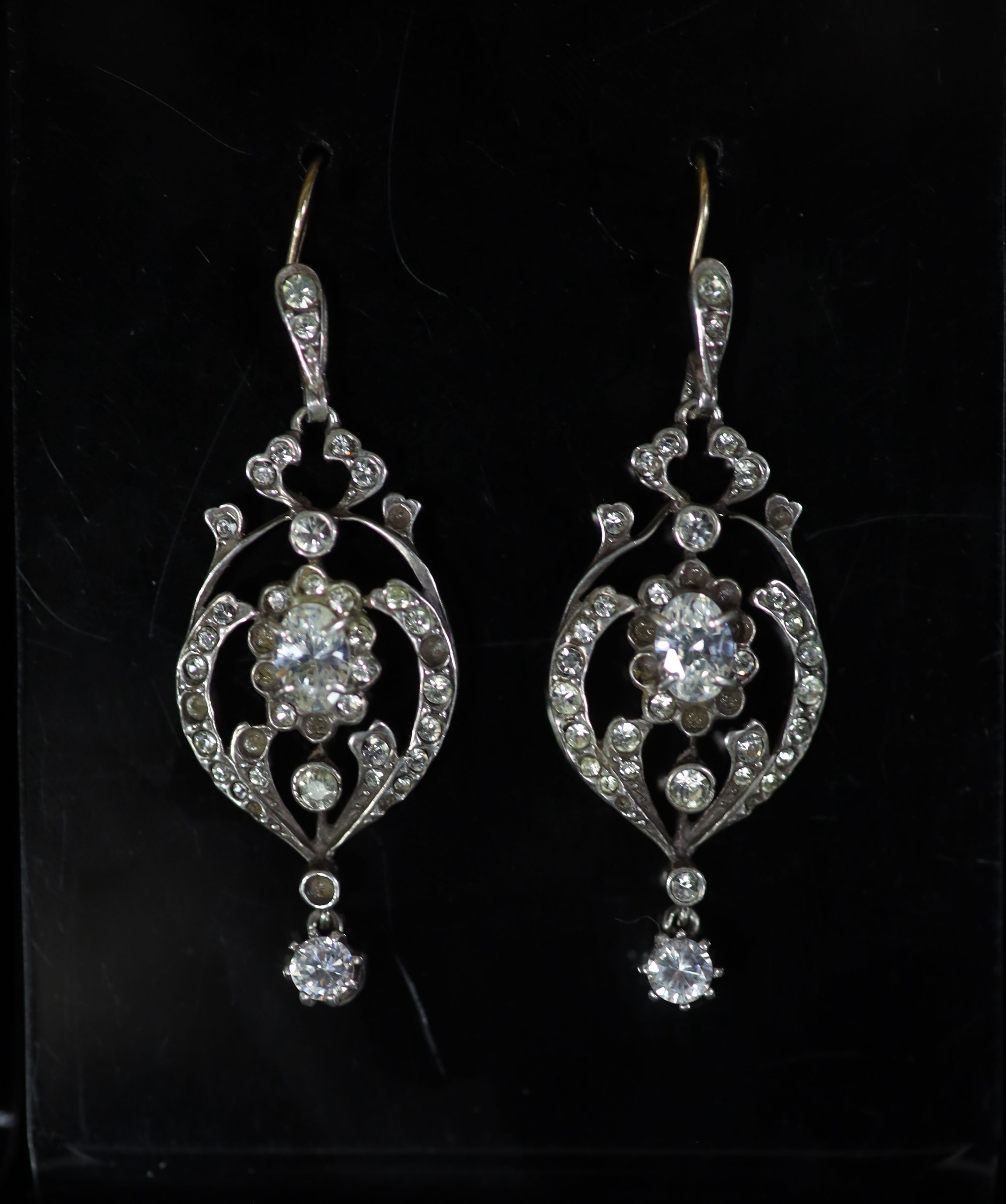 An ornate silver and paste set drop pendant necklace and pair of similar drop earrings